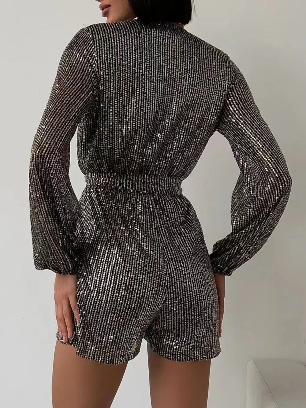 Full Size Sequin Surplice Tie Waist Long Sleeve Romper - V.I.P Digital Presence