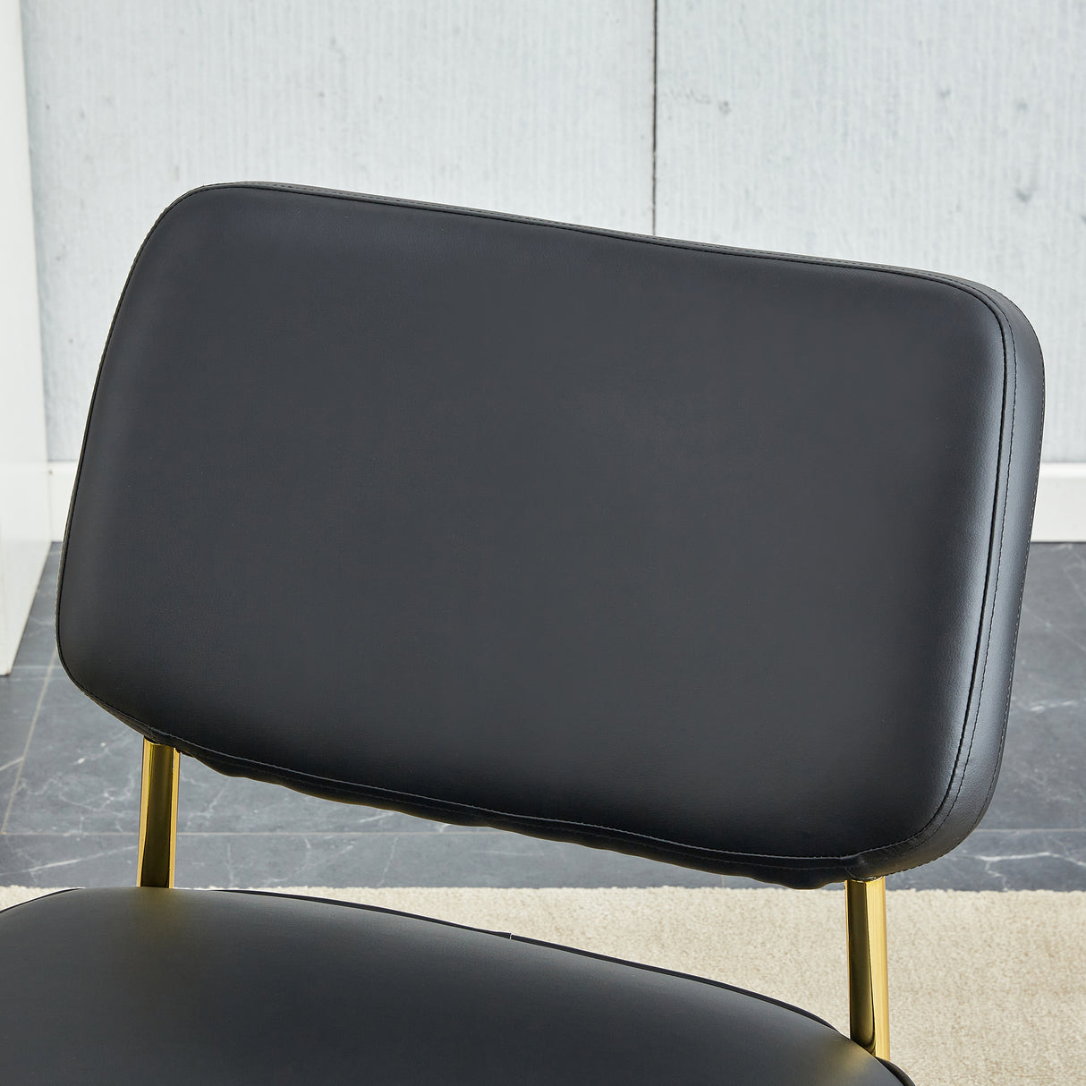PU material cushioned rocking chair unique rocking chair cushioned seat black backrest rocking chair and gold metal legs