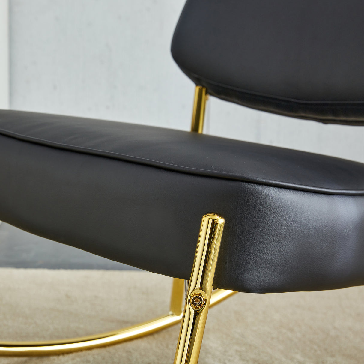 PU material cushioned rocking chair unique rocking chair cushioned seat black backrest rocking chair and gold metal legs