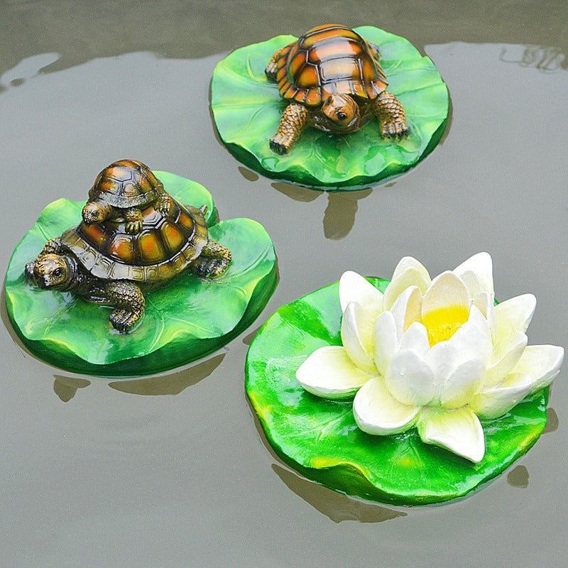 Turtle resin ornaments floating on the water surface - V.I.P Digital Presence