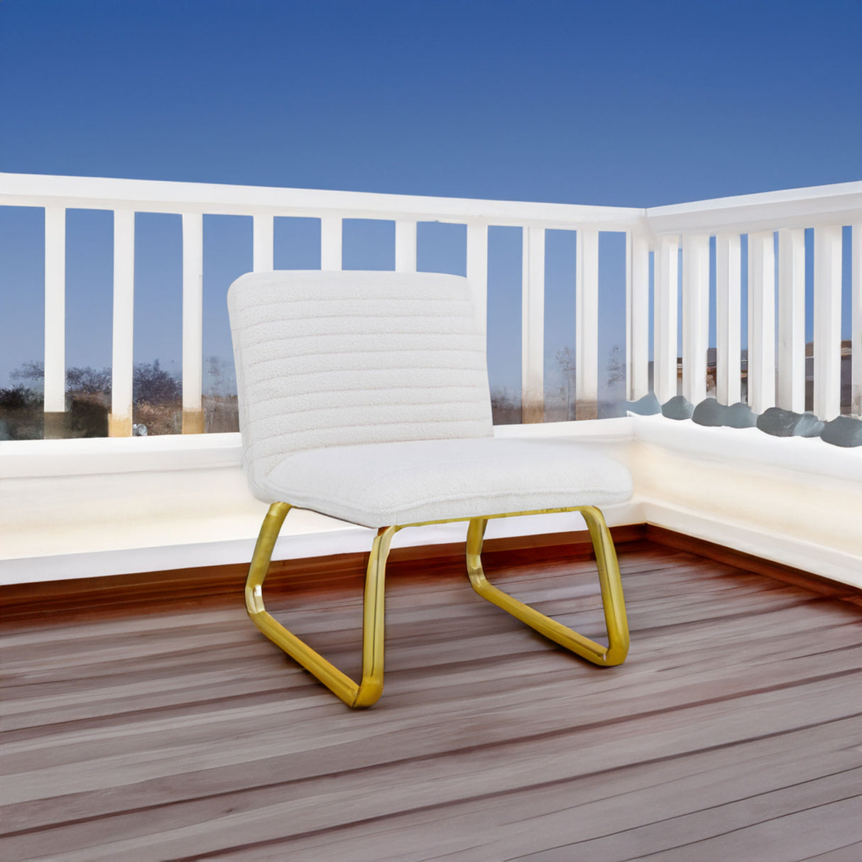One White minimalist armless sofa chair with plush cushion and backrest paired with golden metal legs