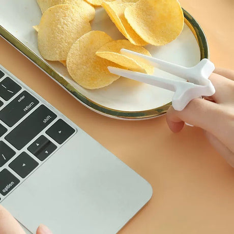 Playing games with fingers chopsticks snacking clips not dirty hands chopsticks finger loops - V.I.P Digital Presence