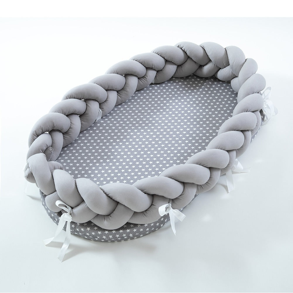 Cuna portátil plegable de algodón tejido, biónica, con valla manual extraíble y protección tridimensional. 