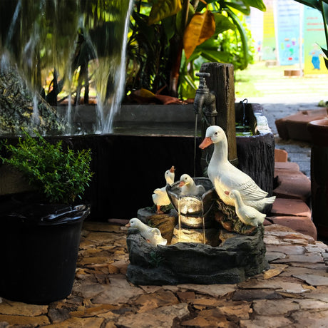 Solar resin duck garden fountain with LED squirrel design, outdoor decor (E2). - V.I.P Digital Presence