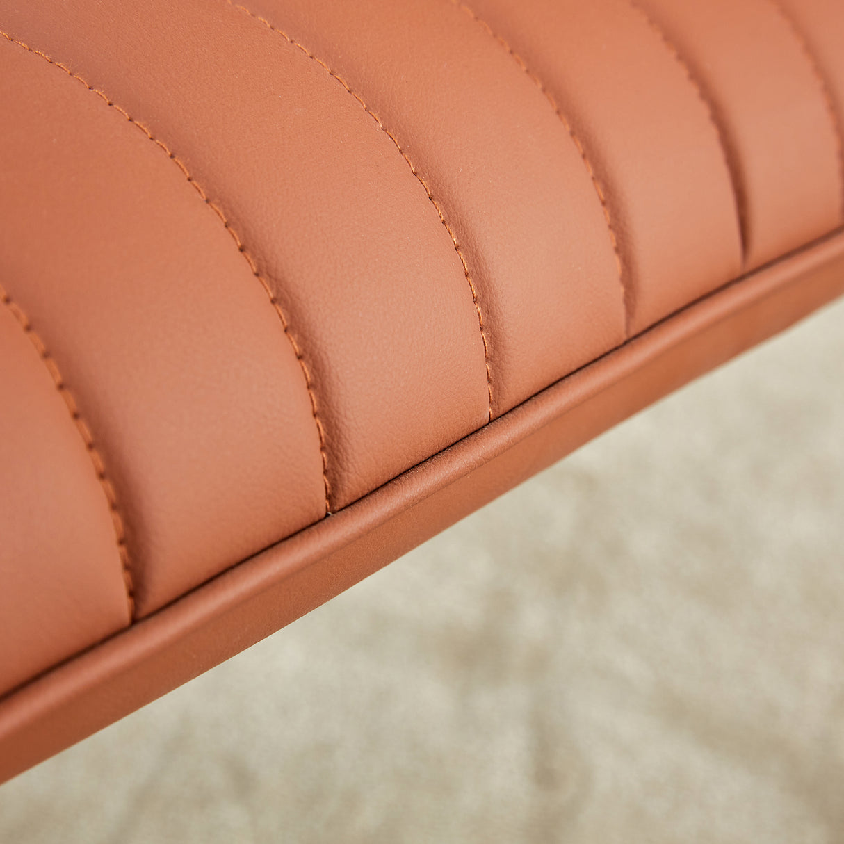Brown minimalist armless sofa chair with PU backrest and black metal legs